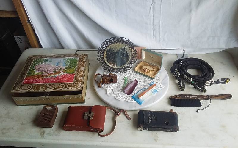 Decorative Tin Box, Marble Trivet, Old Camera, Lace Doily, New Belts(26 & 30, 30 & 34), Bracelet, Old Beveled Mirror