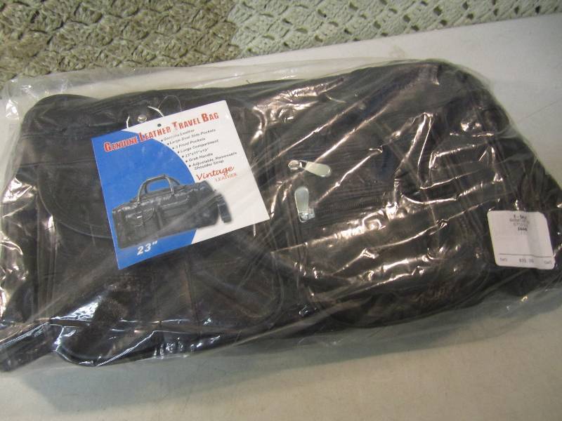 lot 201 image: 23 Genuine Leather Travel Bag Reta...