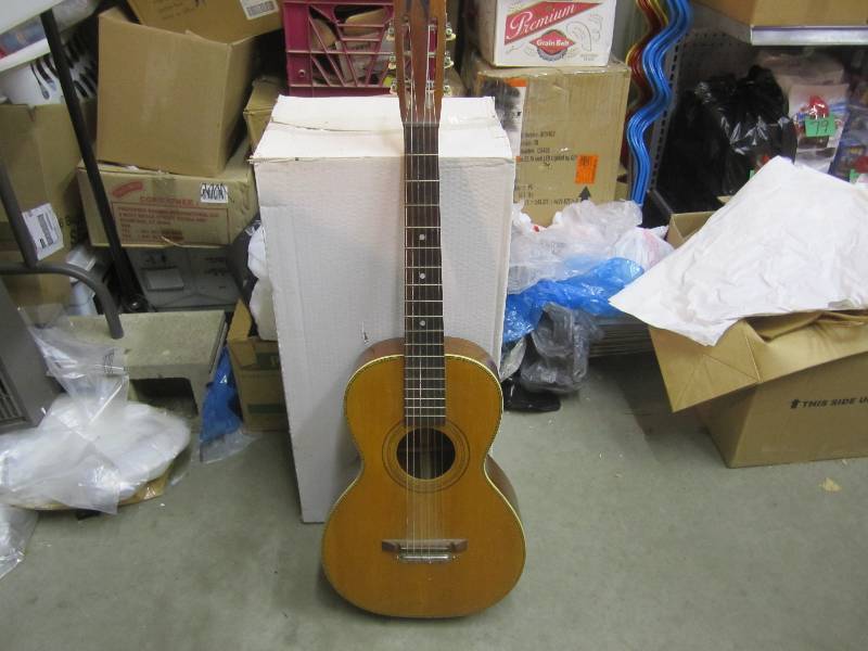 lot 259 image: Acoustic Guitar Crack at neck base....