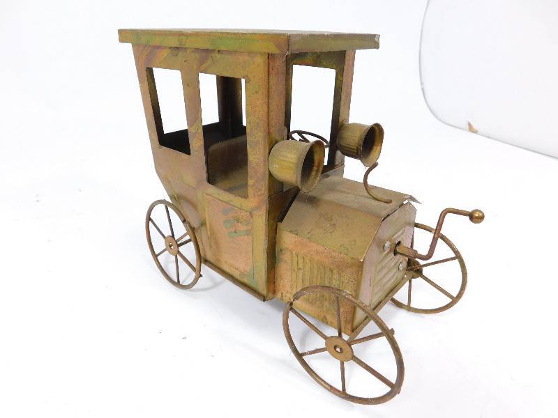 lot 27 image: Copper Model T Car Music Box