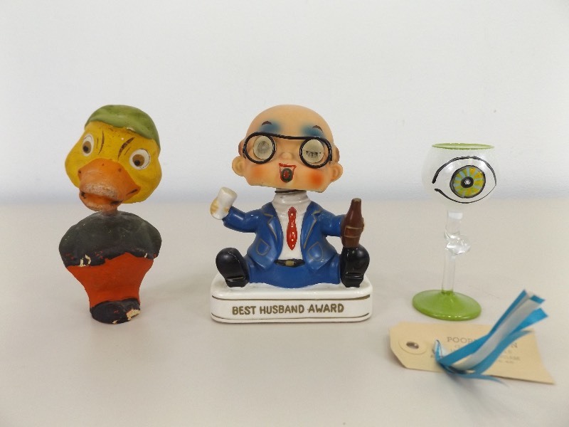 lot 31 image: Antique Duck Bobble Head, Vintage Husband Bobble Head, and Hand BlownPainted Poopa Design Glass