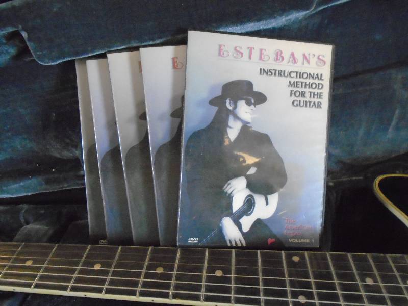 lot 12 image: AcousticElectric Guitar and Instructional DVDs