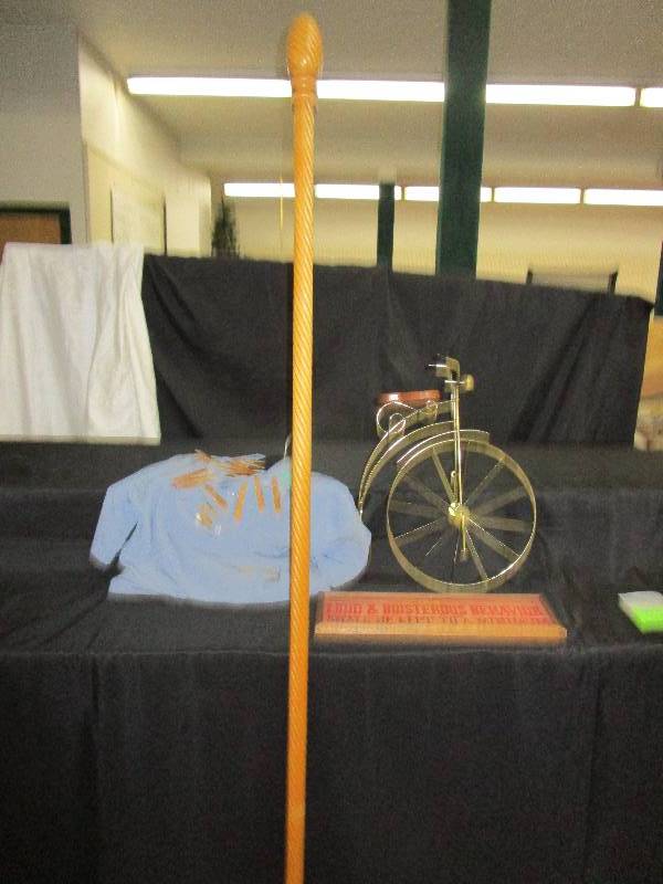 lot 37 image: 7 ft Carosel Pole, Bike Decot, Clothespin Holder with Clothespins and Sign