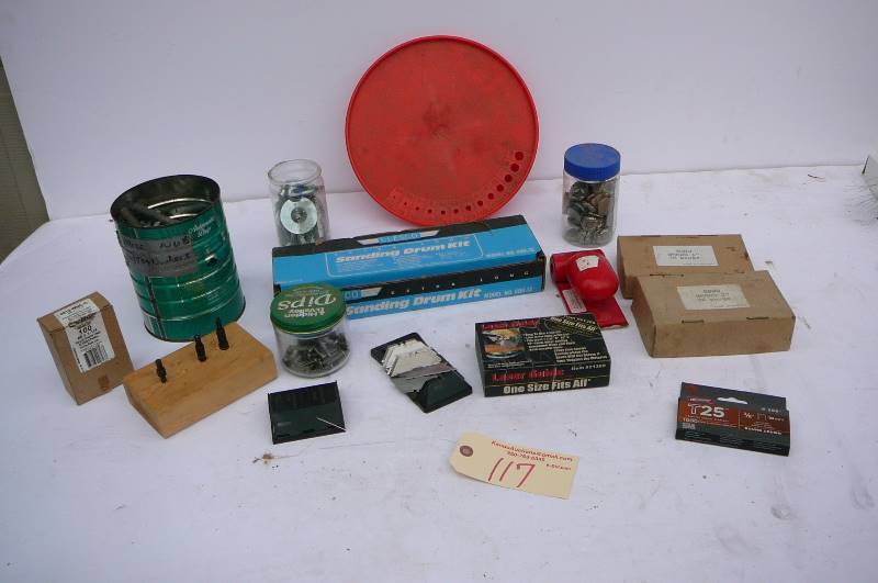 lot 117 image: Sanding drum kit, raze black dispenser with lots of blades, Laser guide, brads 1 16 gauge, 2 16 gauge, misc. nuts, bolts, washers, jar of lead