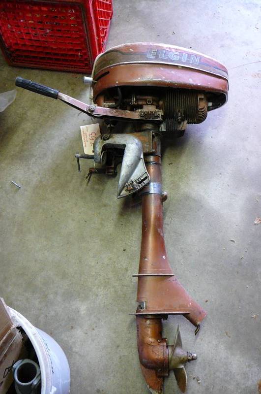 lot 353 image: Vintage Elgin outboard motor pulls over model #571-58232