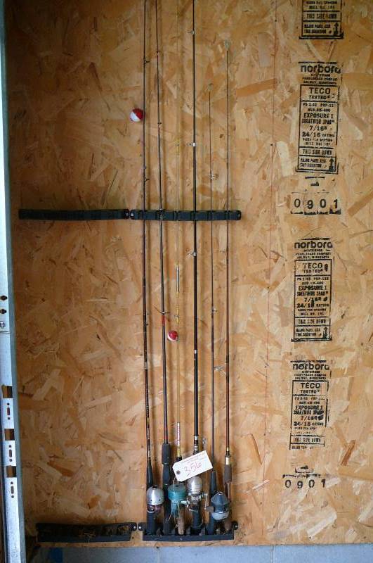 lot 356 image: 4 Fish rods with reels and 2 fishing poles with no reels, 1 zebco, 1 Sport light, 1 Heddon rod and reel, 1 Berkley rod. 1 Fish Bonz rod and reel