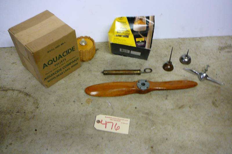 lot 476 image: Patio umbrella pole lamp, kasen candle, box of aquacide pellets, wooden propeller, little oil cans