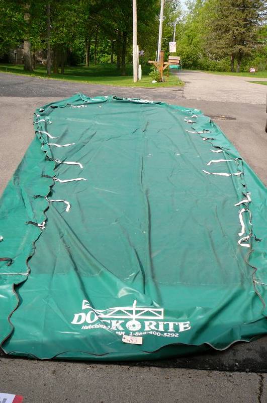 lot 483 image: Green canopy cover Dock Rite no rips or tears with good straps Like New 120w x 23