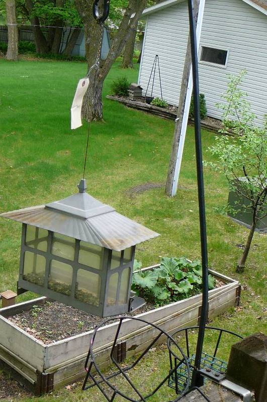 lot 520 image: Bird feeders, and 2 flower pot holders Buyer needs to remove brackets- Bring your own tools