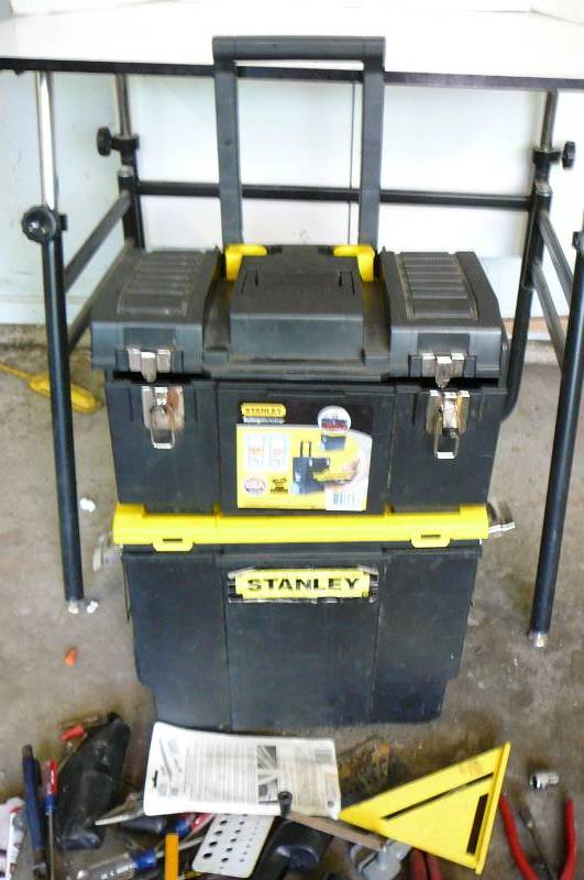 lot 539 image: Stanley rolling workshop 3 in 1 made in USA with misc. tools, tin snips, pipe wrench, crescent wrench, screw drivers, wire snipper, vice grips, chizzles, Kemelon tape measure, box cutters, rope light