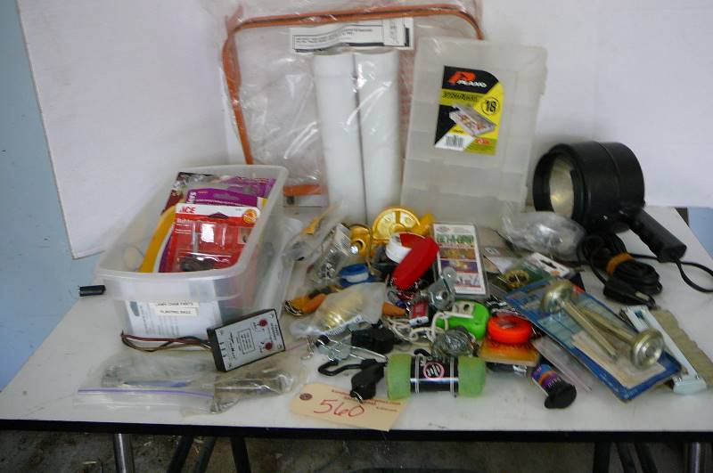 lot 560 image: Lawn chair parts, planting bags, boot dryer, extension, Q- beam spotlight, small clamps, casters, bag holder, plano stow away and misc.