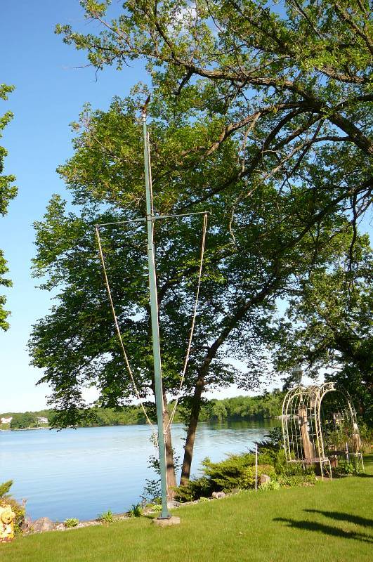 lot 595 image: Flag pole metal with brass eagle topper 30 pole.  Buyer will need to remove from base so bring your own tools and help to remove