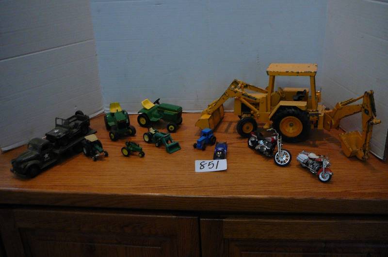 lot 851 image: Collectable toys John Deere back hoe, Motorcycles, Military truck and jeep, John Deere tractors