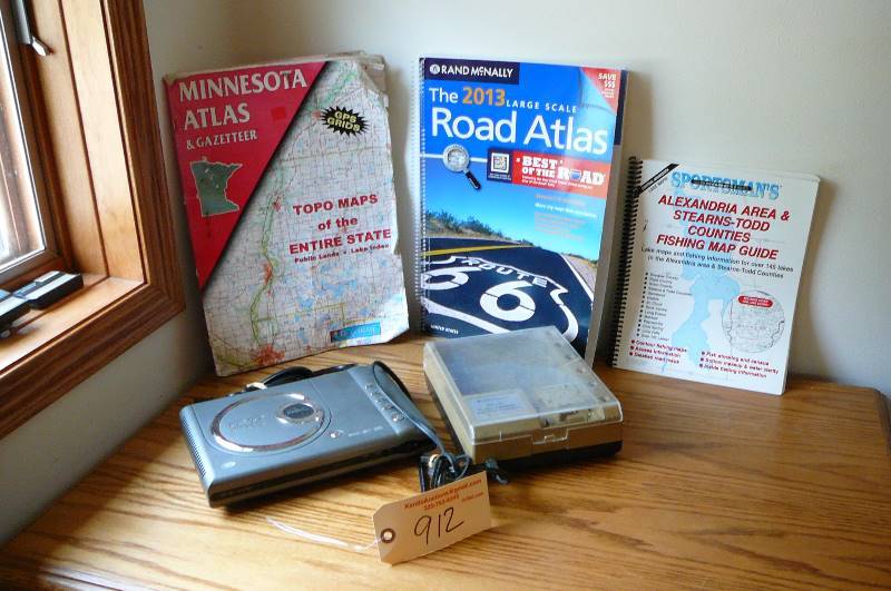 lot 912 image: Portable DVD Player, battery charger, Road Atlas