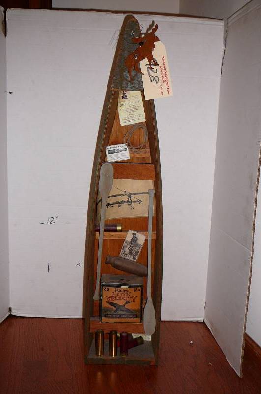lot 928 image: Decorative hunting canoe