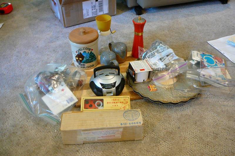 lot 974 image: Cake decorating, Small radio, Crock, Pepper grinder, Cutting board, Spritz cookie maker