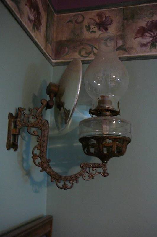 lot 982 image: Antique Oil Lamp with Finger hole and Reflector