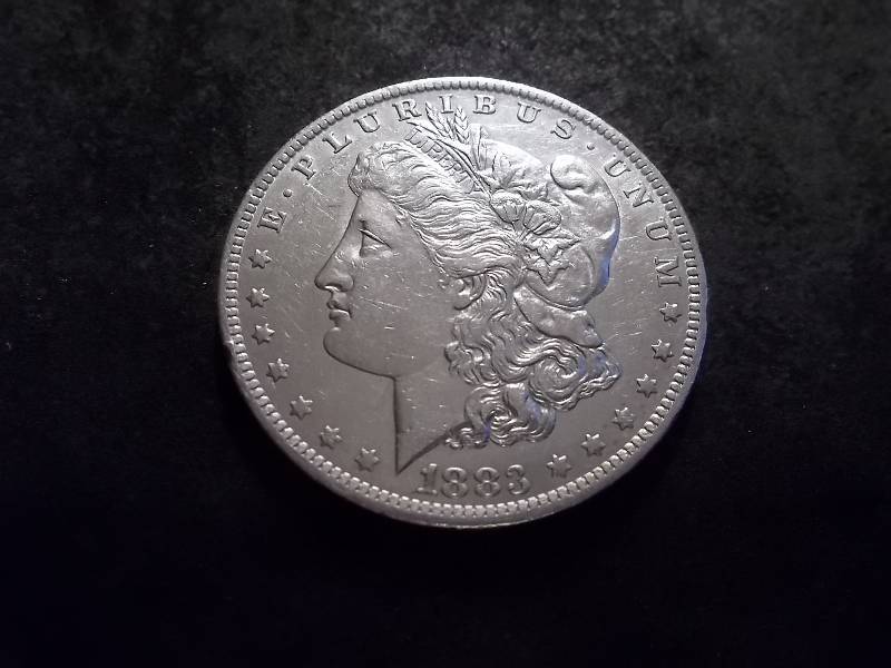 lot 15 image: 1883 O Morgan Silver Dollar