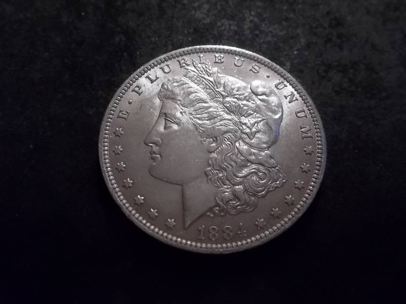 lot 17 image: 1884 O Morgan Silver Dollar