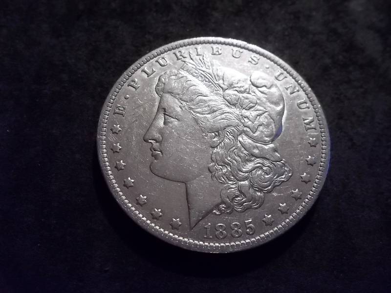 lot 19 image: 1885 O Morgan Silver Dollar