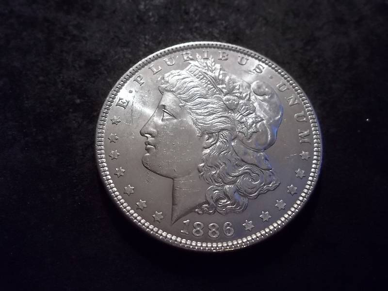 lot 21 image: 1886 Morgan Silver Dollar