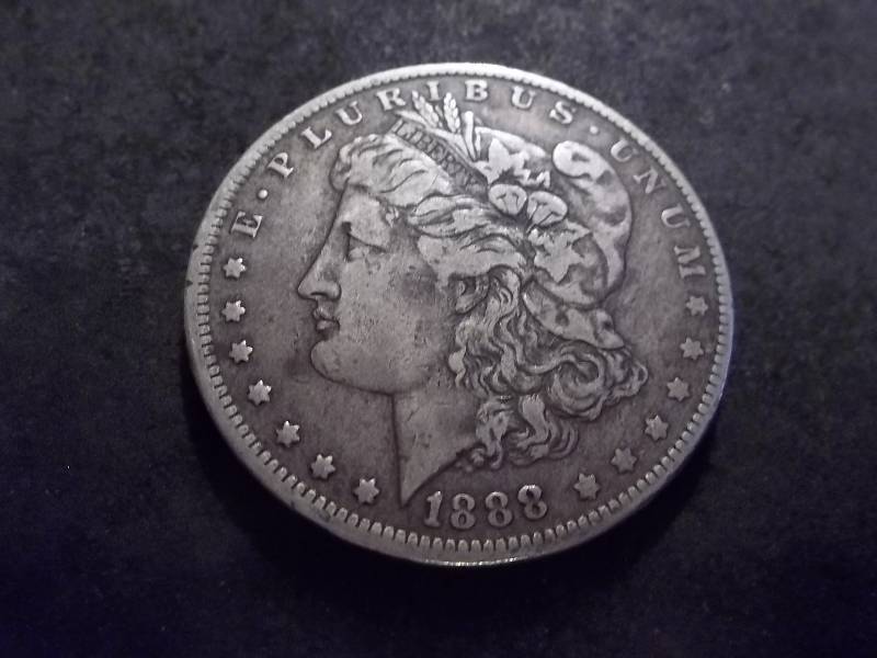lot 24 image: 1888 O Morgan Silver Dollar
