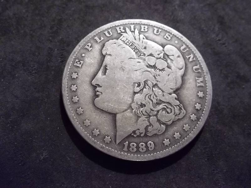 lot 26 image: 1889 O Morgan Silver Dollar