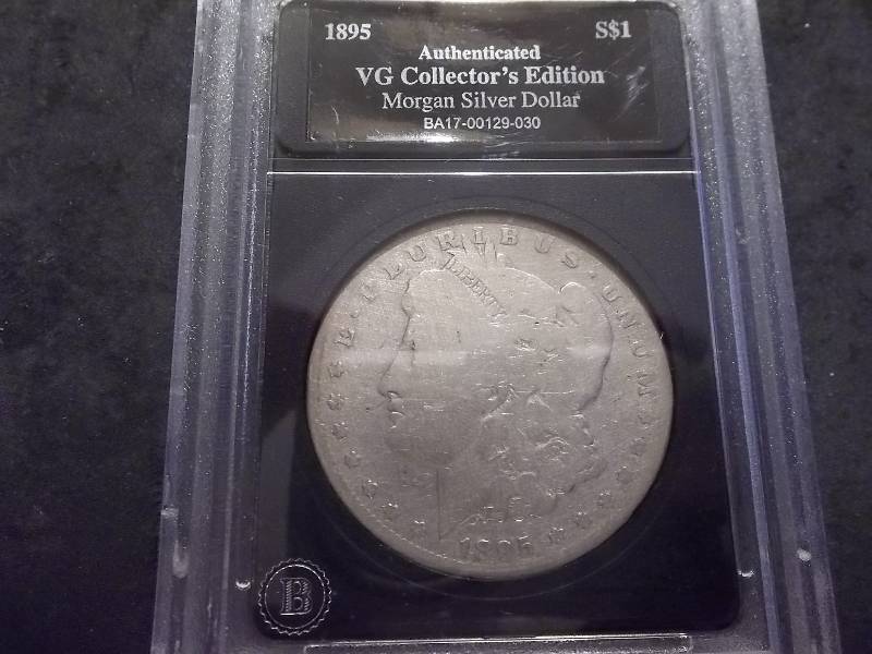 lot 32 image: 1895 O Morgan Silver Dollar