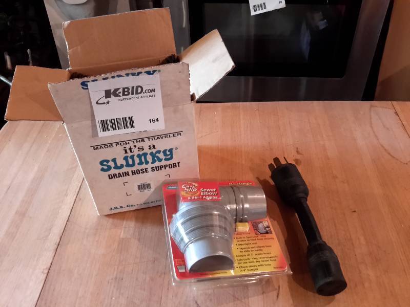 lot 164 image: SLUNKY, drain hose support  Sewer Elbow Adapter. For camper
