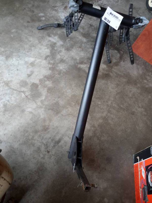 lot 37 image: 4 Bike rack.. Fits into smaller hitch receiver