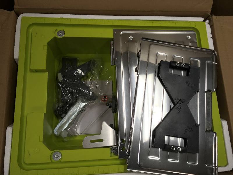 lot 44 image: Ryobi 7 in. 4.8 Amp Tabletop Tile Saw not used like new