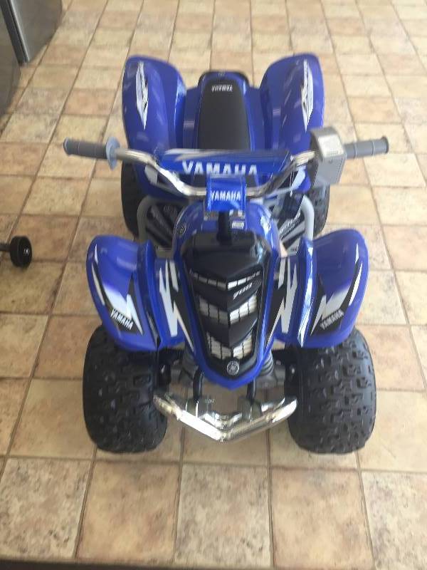 lot 21 image: NEW Yamaha Raptor ATV 12-Volt Battery-Powered Ride-On
