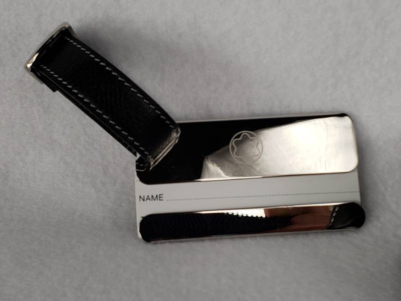 lot 23 image: Montblanc Travel Alarm Clock & Luggage Tag