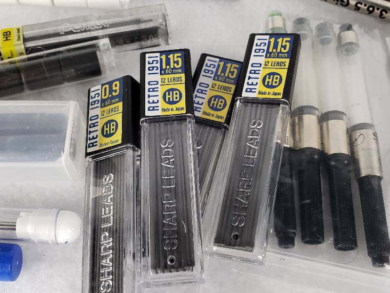 lot 78 image: Large Group of Ballpoint, Fountain, Mechanical Pencil Refills  Leather Pouch
