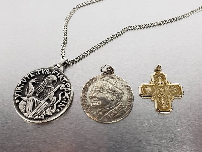 lot 103 image: (1) 14k Gold, (1) Sterling Silver, (1) Medal Catholic Pendants