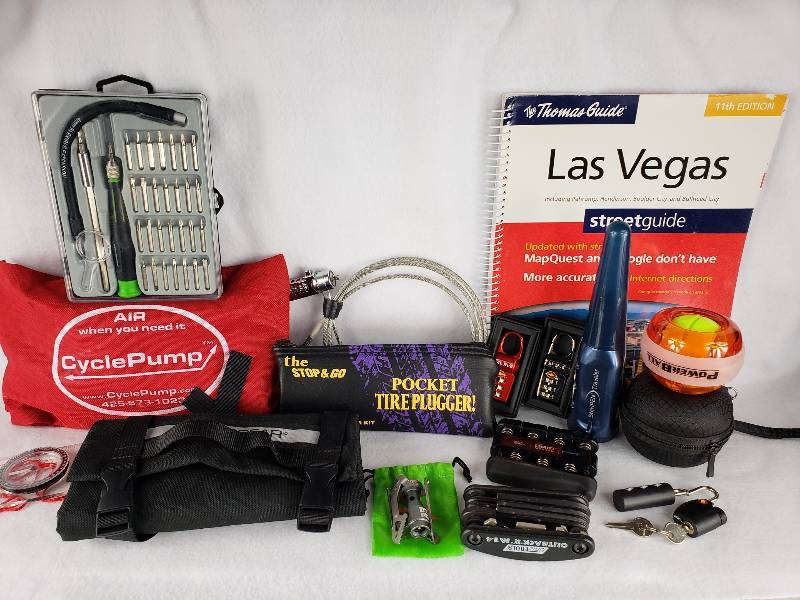 lot 148 image: Cycle Pump, Tire Pluuger, Multi-Tool, SteriPen, PowerBall, Tumi Locks, etc.