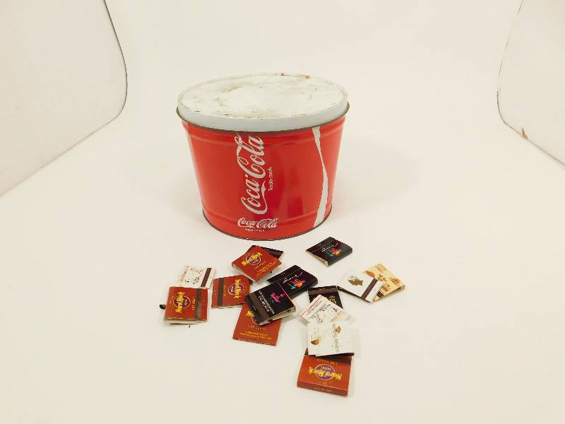 lot 71 image: Coca Cola Tin With Miscellaneous Matchbook Matches