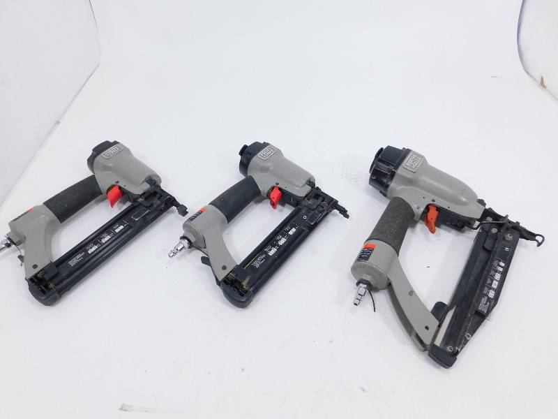 lot 52 image: Two     Porta Cable Pneumatic Brad Nailers-------------One Porta Cable Finish Nailer