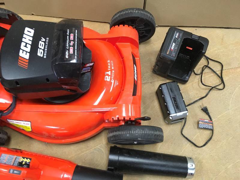 lot 23 image: EHO Combo- Echo 21 in. 58-Volt Brushless Lithium-Ion Cordless Battery Walk Behind Push Lawn Mower - and ECHO Leaf Blower  1 BatteryCharger Included - mower battery plastic cover has a small crack Not used