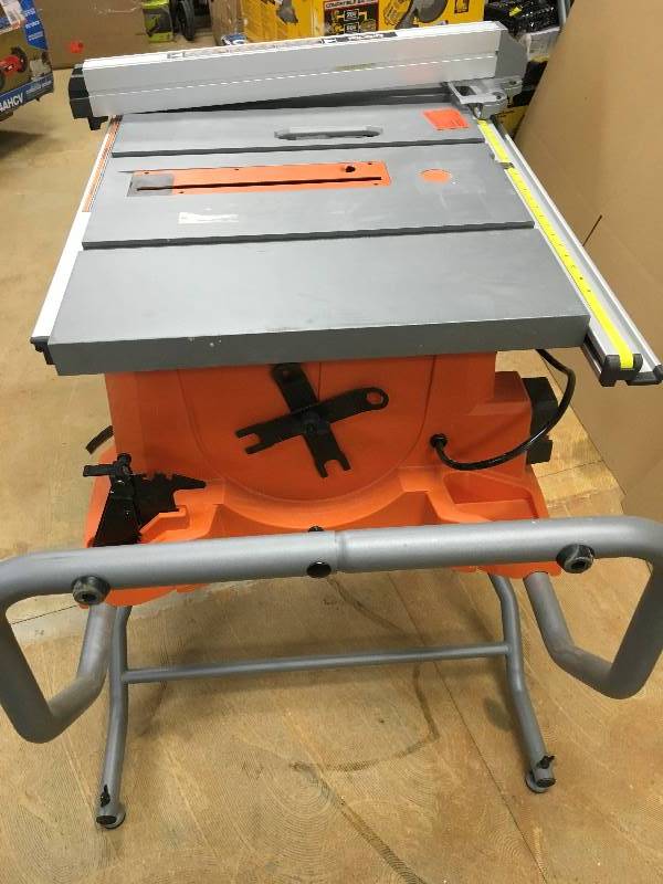lot 30 image: RIDGID 15 Amp 10 in. Heavy-Duty Portable Table Saw with Stand in working conditions