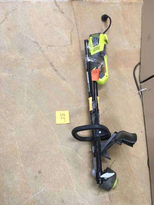 lot 35 image: RYOBI 18 in. 10 Amp Electric String Trimmer used in very goo condition