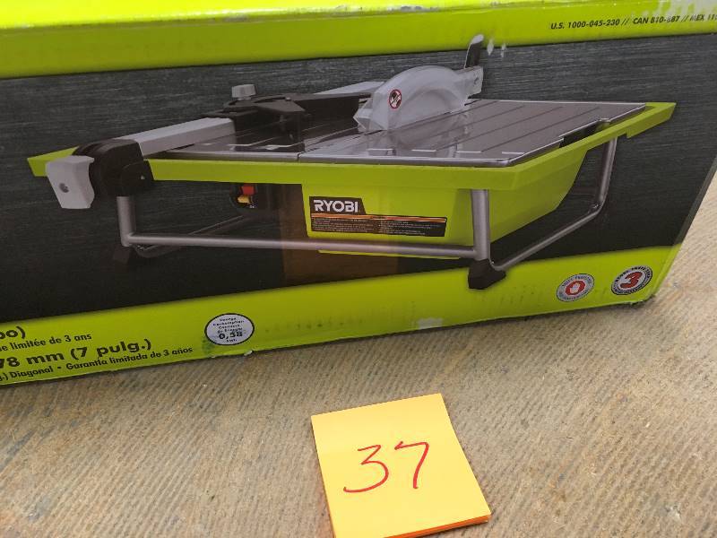 lot 37 image: RYOBI 7 in. 4.8 Amp Tabletop Tile Saw DeWalt  in working conditions