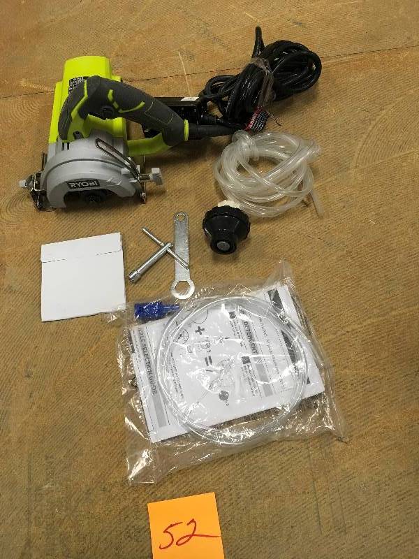 lot 52 image: RYOBI 4  in. Hand Held Tile Saw Not used