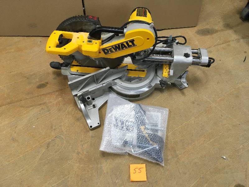 lot 55 image: DEWALT 15 Amp 12 in. Double Bevel Sliding Compound Miter Saw Model # DWS780 in like New conditions
