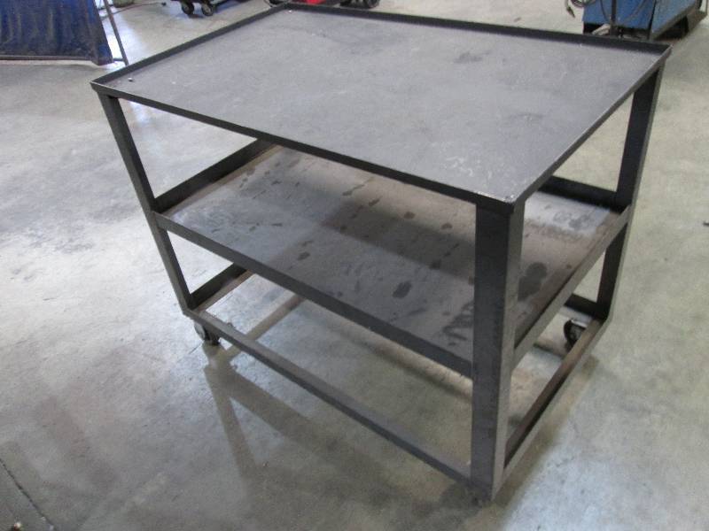 lot 81 image: Metal cart on wheels, top is 46 12...