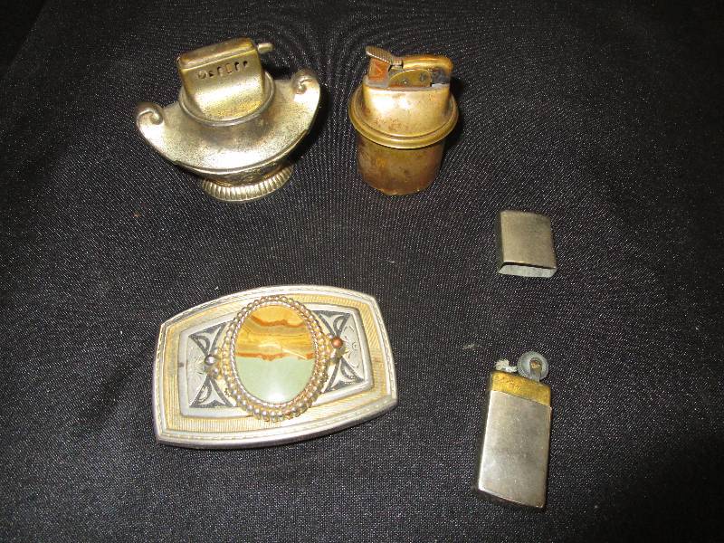 lot 54 image: 3 Lighters and Belt Buckle