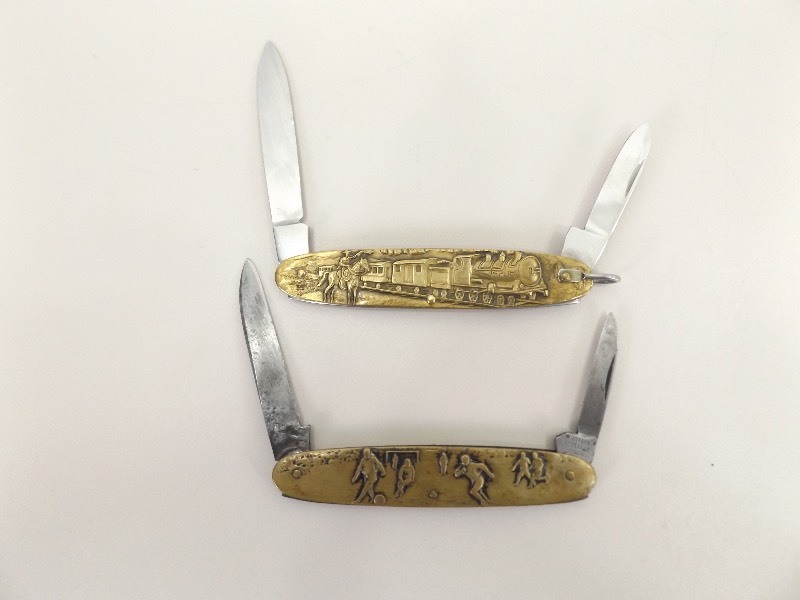lot 9 image: 2 Vintage Solingen Brass Skin Themed Pocket Knives