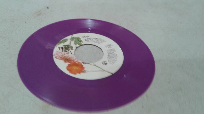 lot 99 image: 7 Prince When Doves Cry Purple Vinyl Record