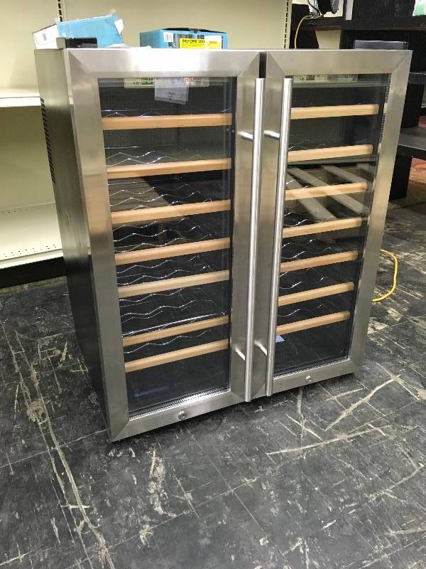 lot 294 image: Wine Enthusiast 48 Bottle Wood Wine Cellar, Retail $549.99