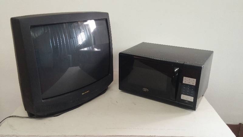 lot 12 image: Sharp tv& microwave oven